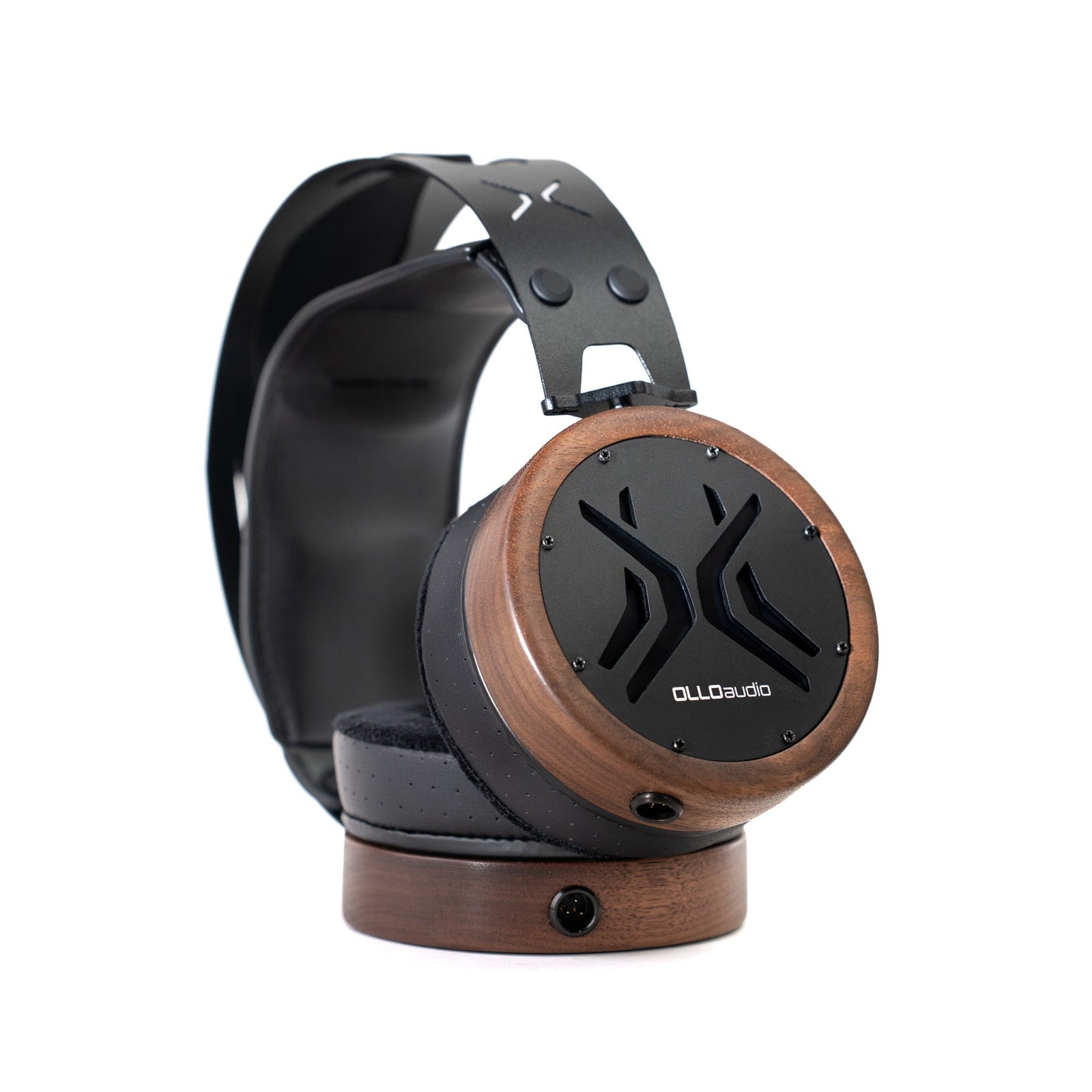 OLLO Audio X2 open-back studio headphones on a walnut stand
