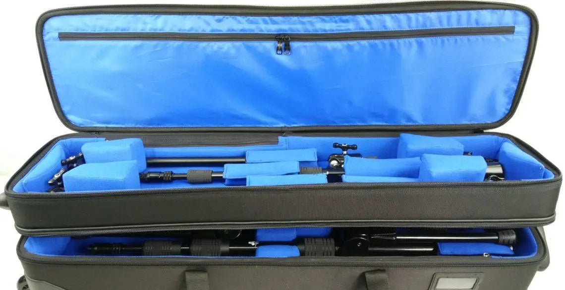 The Triad Shuttle Bag keeps two TRIAD-ORBIT stand systems safe and sound, to and from the gig with plenty of extra room for miscellaneous accessories. The Triad Shuttle Bag is a robustly constructed dual tier bag that allows the user to load and unload the bag with ease. Features  Hard framed side walls Super strong, smooth rolling wheels Velcro hold downs Dual handles for easy loading 4 inner sidewall pocket Large lid pocket 2 accessory bags inside the lid pocket